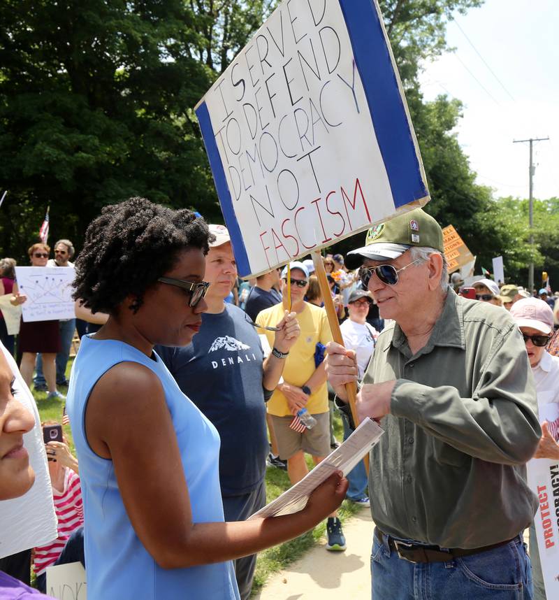U.S. Rep. Lauren Underwood talks with a United States Army Veteran at the No Kings Protest in Yorkville on Saturday, June 14, 2025.