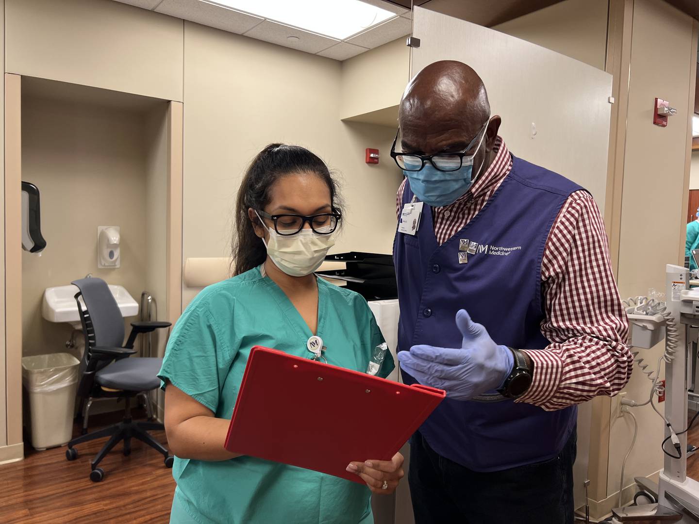 Northwestern Medicine Delnor Hospital nurse Elena Flores works with volunteer Ivory Daniels.