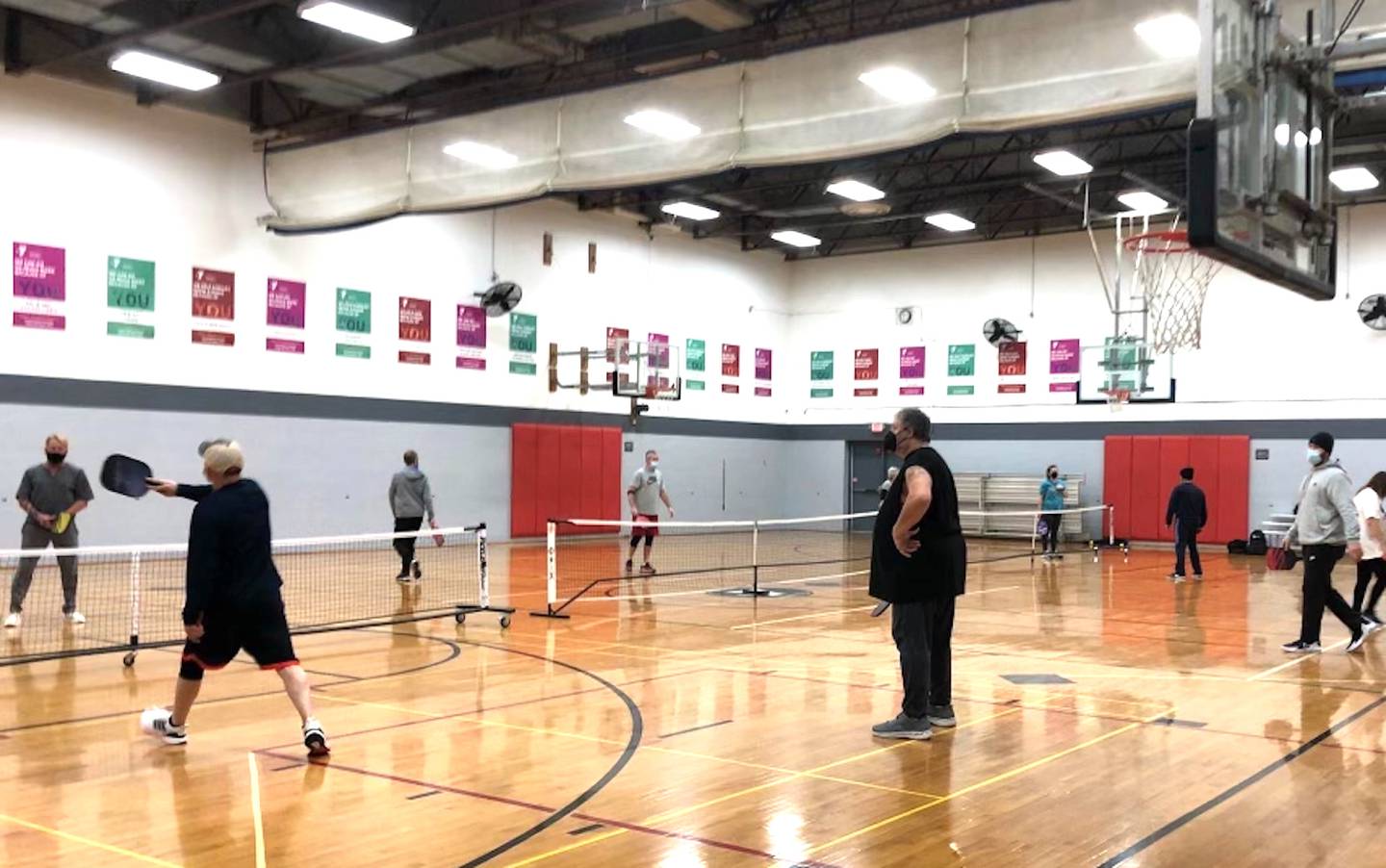 Three courts are filled with pickleball players at the Streator Family YMCA in this photo taken while masks were still required at the facility due to efforts to contain COVID-19. The organization plans to break ground on an outdoor pickleball facility later this month.