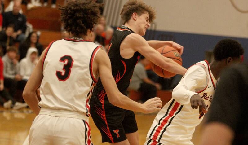 Crystal Lake Central’s  Drew Welder moves the ball against Huntley during tournament basketball action at Johnsburg High School Monday evening.