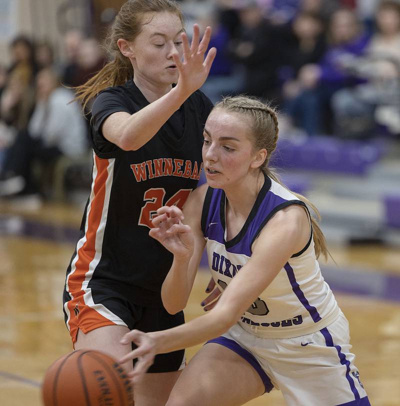 Dixon’s Kait Knipple makes a pass down low Monday, Jan. 9, 2023 against Winnebago’s Jocelyn Harms.