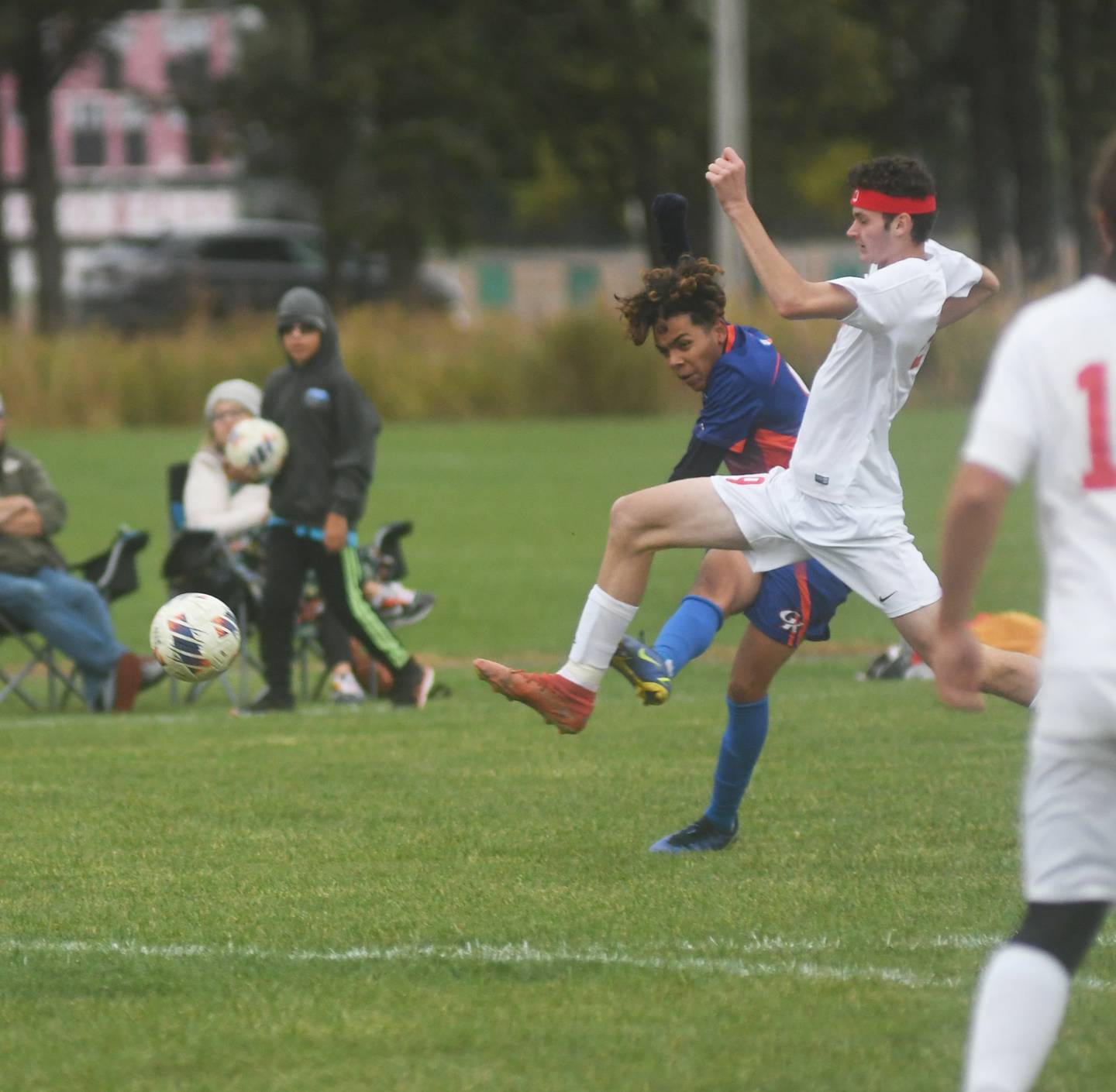 Genoa-Kingston's Javier Pizano takes a shot on goal as Oregon's Miley Smith tries to get a piece of the ball during 1A regional action in Oregon on Friday, Oct. 14, 2022.