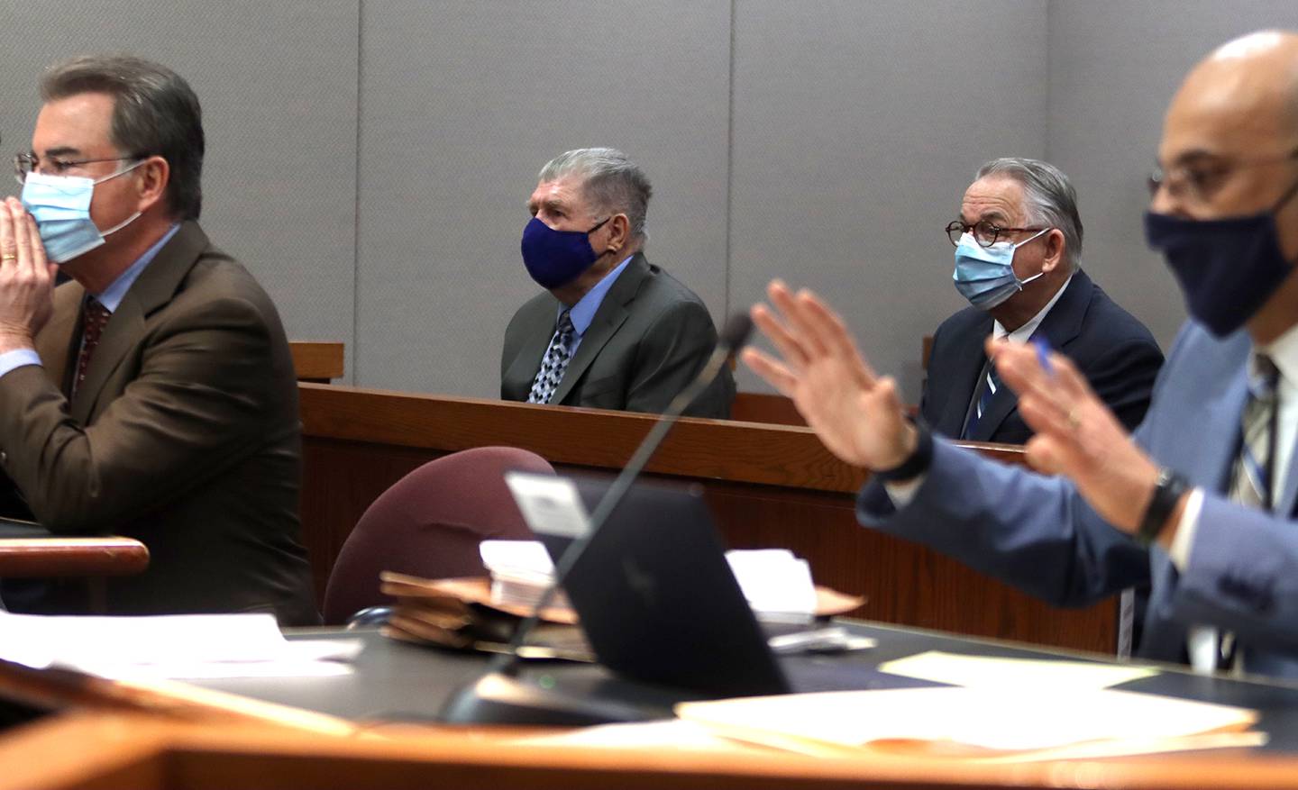 McHenry County State's Attorney's Office prosecutor Ashur Youash, right, speaks as defense attorney Phil Prossnitz, left, listens during a hearing for defendants Colin Scott, center left, and Michael Penkava, center right, Thursday, Dec. 16, 2021, at the Michael J. Sullivan Judicial Center in Woodstock.