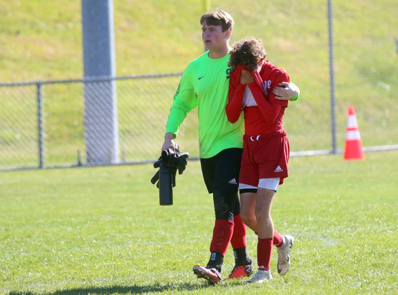 Streator keeper Andrew Vogel helps teammate Issca Fowler off of the field after loosing 1-0 against Galesburg during the Class 2A Regional final on Saturday, Oct. 26, 2024 at Ottawa High School.