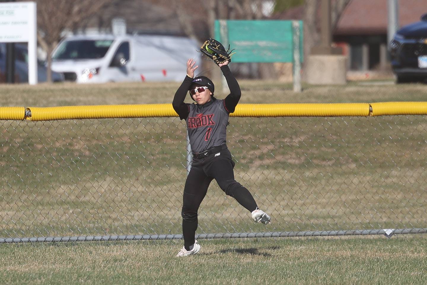 Bolingbrook’s Karina Choi back-peddles for the fly ball against Plainfield Central on Wednesday, March 20, 2024.