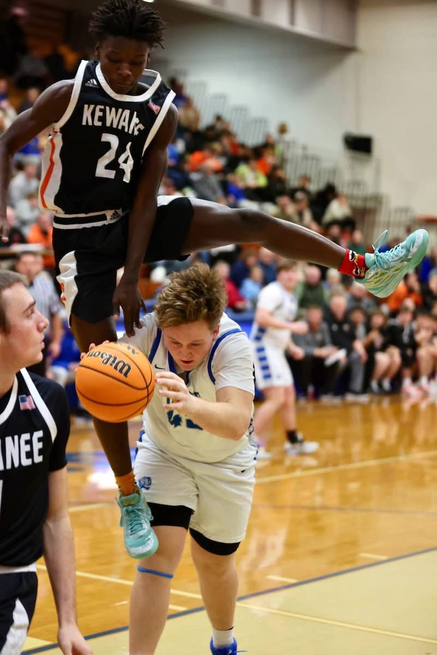 Kewanee's Dontaveon Thomas takes a ride on Princeton's Luke Smith Tuesday night at Prouty Gym. Smith was fouled on the play and sent to the free throw line. The Tigers won 60-21.