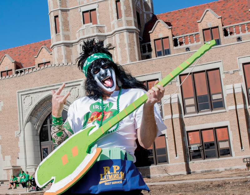 2015 FILE: Mike Lahey, of Dixon, rocks out on a plywood guitar in front of Dixon High School.