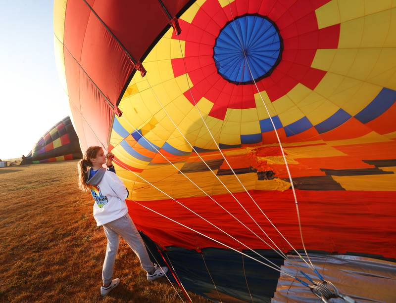 Volunteer Emma Carlson, of Tiskilwa helps launch a hot air balloon during the 52nd annual Homestead Festival on Saturday, Sept. 9, 2023 in Princeton.