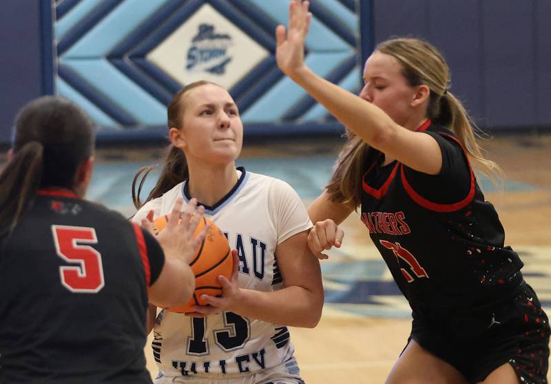 Bureau Valley's Libby Endress,  looks to split Erie-Prophetstown defenders Ashlyn Johnson and Aubrey Huisman during the Thanksgiving Tournament on Wednesday, Nov. 19, 2025 at Bureau Valley High School.