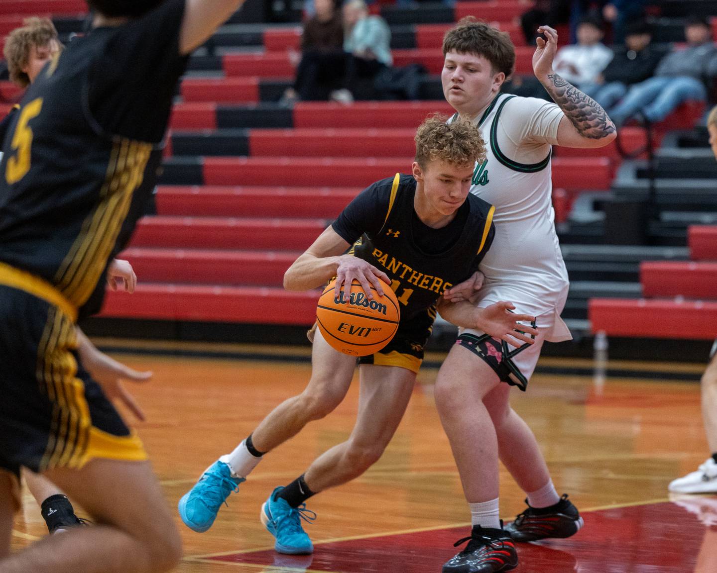 Andrew Gibson (11) of Putnam County bumps into Austyn Feldthouse (32) of Rock Falls during the Colmone Classic on Monday, December 8, 2025 at Hall High School in Spring Valley.