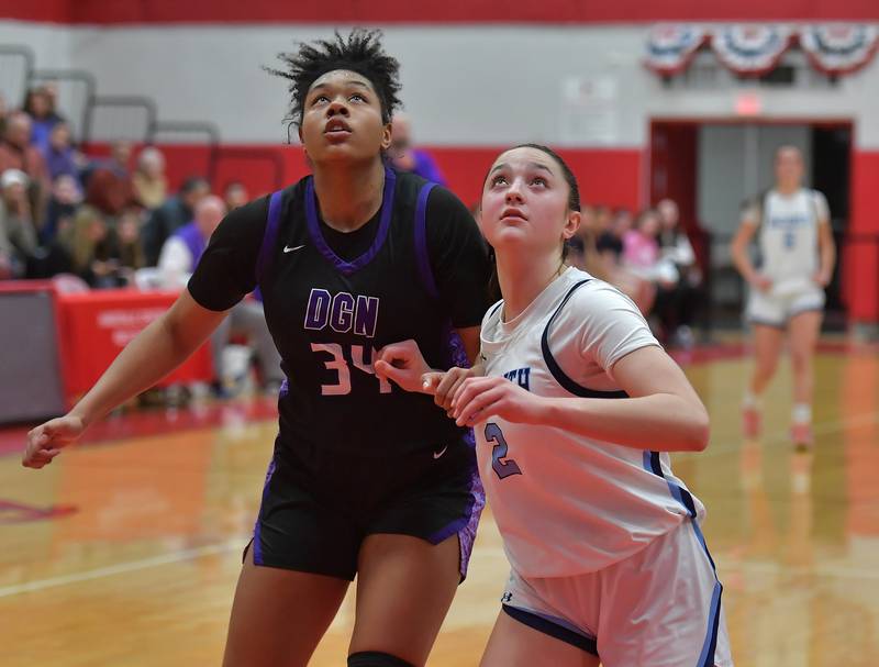 Downers Grove North’s Elizabeth Murphy (34) and Nazareth’s Samantha Austin position for a rebound during the Class 4A Hinsdale Central Sectional final game on February 26, 2026 at Hinsdale Central High School in Hinsdale.