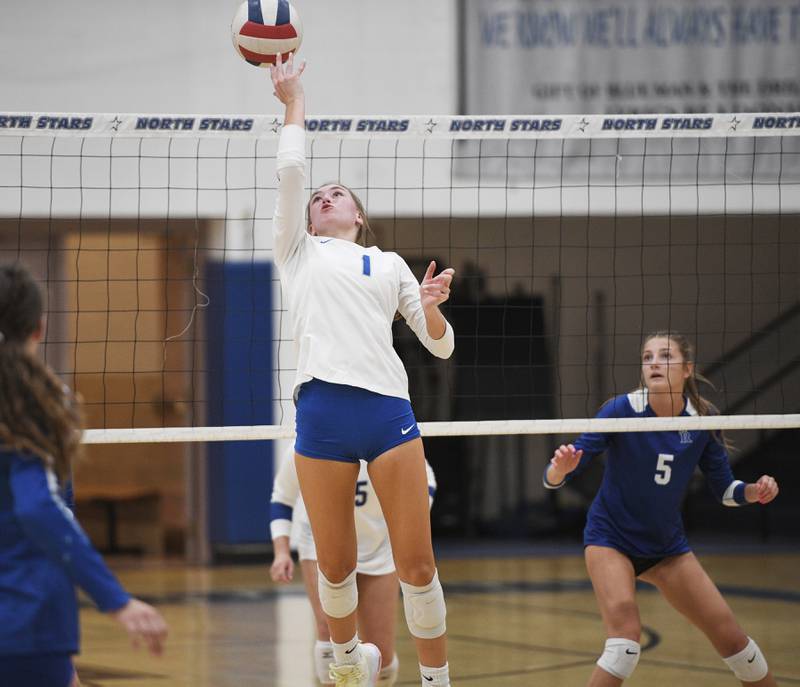 St. Charles North’s Jessica Parker flips the ball aver her shoulder against Rosary in a girls volleyball game in St. Charles on Monday, August 22, 2022.