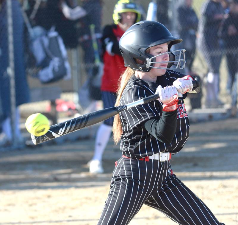 Forreston's Nevaeh Scheffner gets a piece of the ball as she bats against River Ridge/Scales Mound on Monday, March 24, 2025 in Forreston.