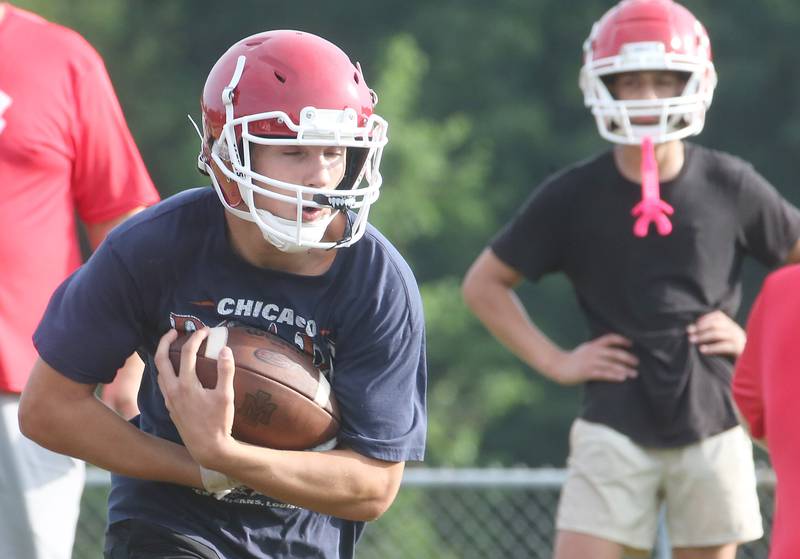 Hall's Dylan Glynn, runs with the ball during camp on Thursday, July 24, 2025 at Hall High School.