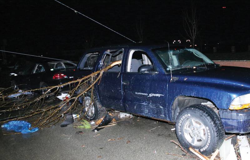 A branch portrudes inside a damaged vehicle on Tuesday, Feb 28, 2017 in Naplate.
