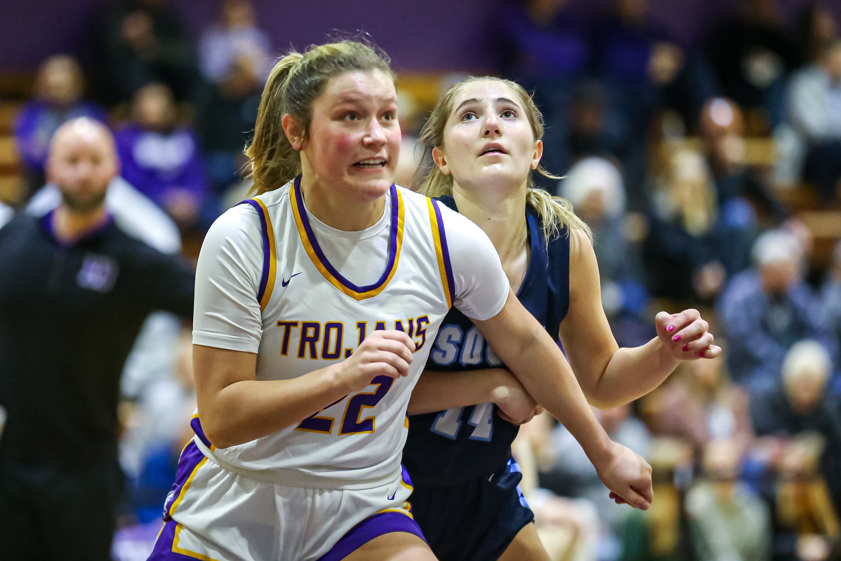Downers Grove North's Lilly Boor (22) blocks out Downers Grove South's Allison Jarvis (14) at the free throw line during girls basketball game between Downers Grove South at Downers Grove North. Dec 16, 2023.