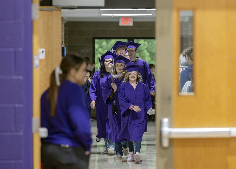 Dixon High School’s graduating seniors walk through Reagan Middle School Wednesday, May 21, 2025, during the traditional “Senior Send-off” in Dixon. Near the end of the school year, the seniors take a stroll through Dixon’s schools to visit facilities that help shape their futures.