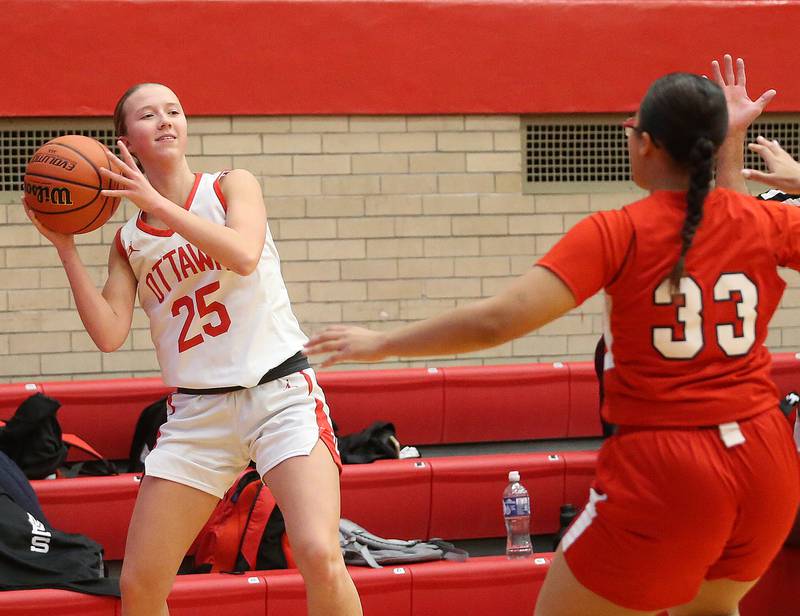 Ottawa's Alay Dorsey looks to pass the ball as Streator's Jade Williams defends during the Lady Pirate Holiday Tournament on Wednesday, Dec. 20, 2023 in Kingman Gym.