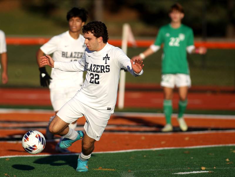 Addison Trail’s Romano Gallo (22) goes after the ball during a Class 3A St. Charles East Sectional semifinal game against York on Wednesday, Oct. 26, 2022.