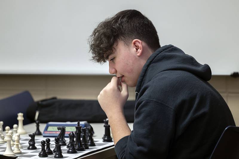Sterling High School sophomore Braydon Pipes works against his opponent Wednesday, Jan. 25, 2023 during chess team practice. Coach Joel Penne said his 12 best players will compete on Saturday during the sectional state qualifier.