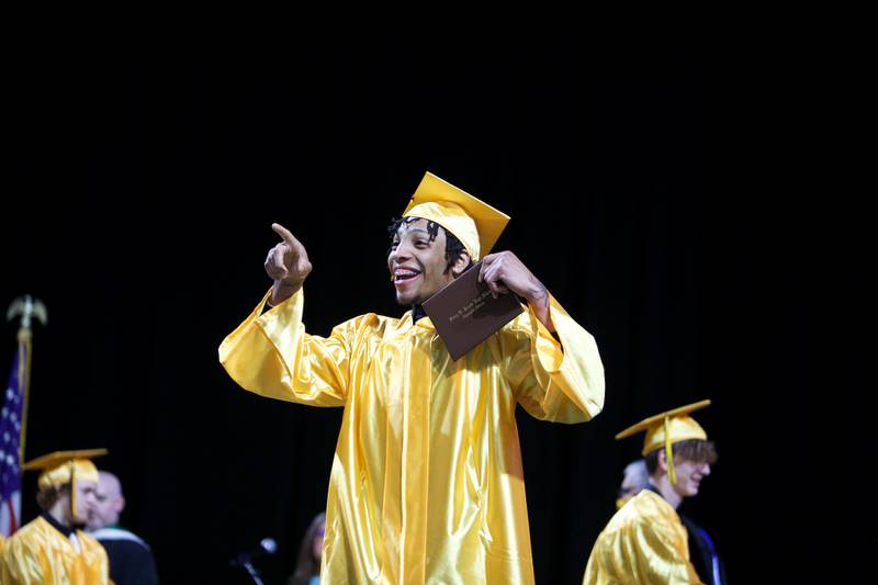 A excited student after receiving their diploma at the Jacobs High School graduation ceremony on May 21, 2022, at the NOW Arena in Hoffman Estates.