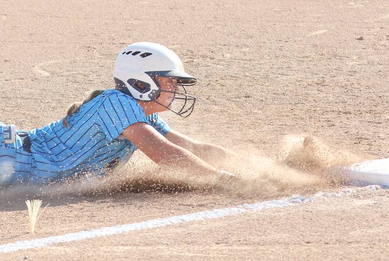 Marquette's Hunter Hopkins slides safely into third base against Henry-Senachwine on Thursday, April 23, 2026 at June Cross Field in Ottawa.