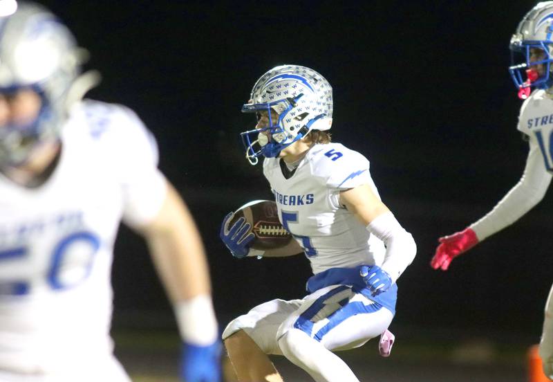 Woodstock’s Jared Kay looks for running room in varsity football at Woodstock North High School on Friday, October 24, 2025.