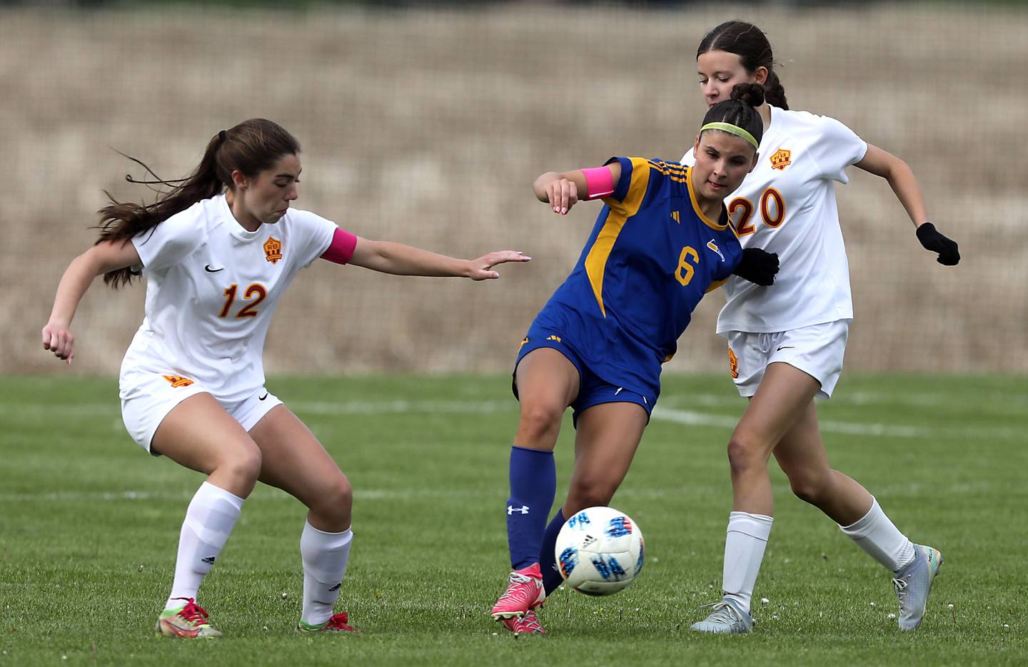 Johnsburg's Liz Smith (center) controls the ball between Richmond-Burton's Nicole Mendlik (left) and Ella Seyller (right) during the Kishwaukee River Conference Girls Soccer Tournament Championship match on Wednesday, May 6, 2026, at Johnsburg High School.