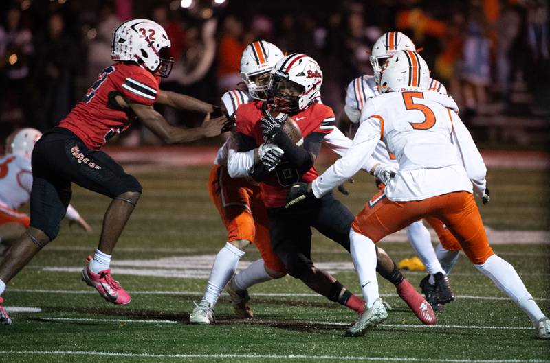 Bradley-Bourbonnais' Rontez Smith, center, carries the ball on a play against Shephard in a Class 6A playoff game on Friday, October 31, 2025.