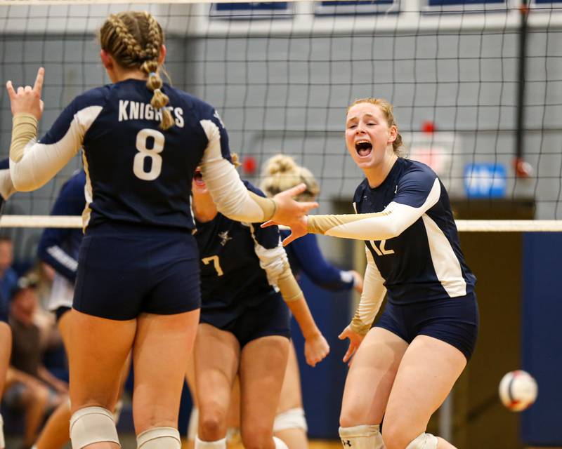 IC Catholic Prep's Maura Grogan (12) celebrates a point with Lucy Russ (8) during volleyball match between Nazareth at IC Catholic Prep.  Aug 29, 2023.
