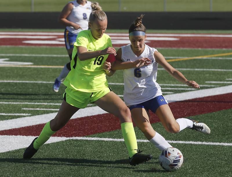 Richmond-Burton's Layne Frericks tries to knock Johnsburg's Kaylee Fouke of the ball during the Kishwaukee River Conference Girls Soccer Tournament Championship Match on Wednesday, May 1, 2024, at Richmond-Burton High School.