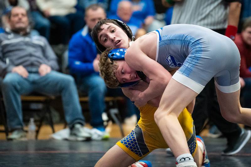 Princeton's Augustus Swanson battles Vince Hefke of Aurora Central Catholic in Saturday's regional title match at Sandwich. Swanson won by fall. He is a returning state qualifier and ranked No. 1 at 106 pounds.