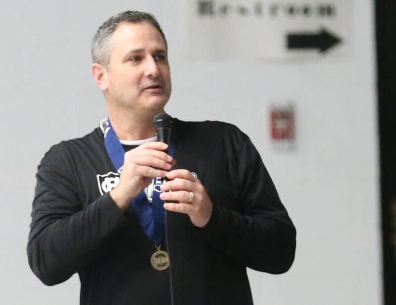 Mendota Holy Cross eighth-grade boys basketball coach Aaron Eddy, delivers a speech to his team during a reception on Tuesday, Feb. 20, 2024 at Holy Cross School. The team beat Pana Sacred Heart 41-33 to win the IESA Class 1A State championship.