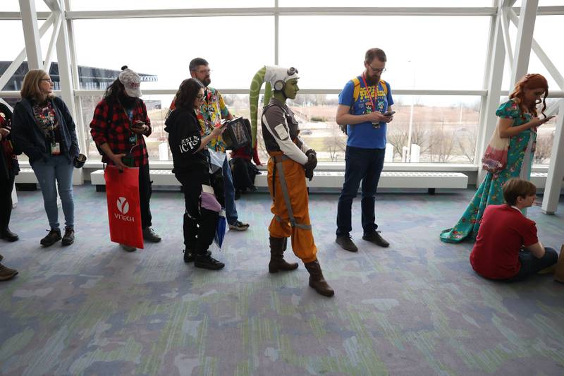 Alexis Ernst (center), dressed as a Twi’lek character, waits in line for the Star Wars Clone Wars: Animation Series 15 year cast reunion panel at C2E2 Chicago Comic & Entertainment Expo on Saturday, April 1, 2023 at McCormick Place in Chicago.