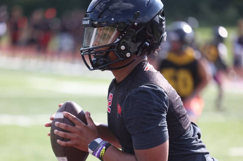 Bolingbrook’s Jayden Lawrence looks to pass at the Morris 7 on 7 scrimmage. Tuesday, July 19, 2022 in Morris.