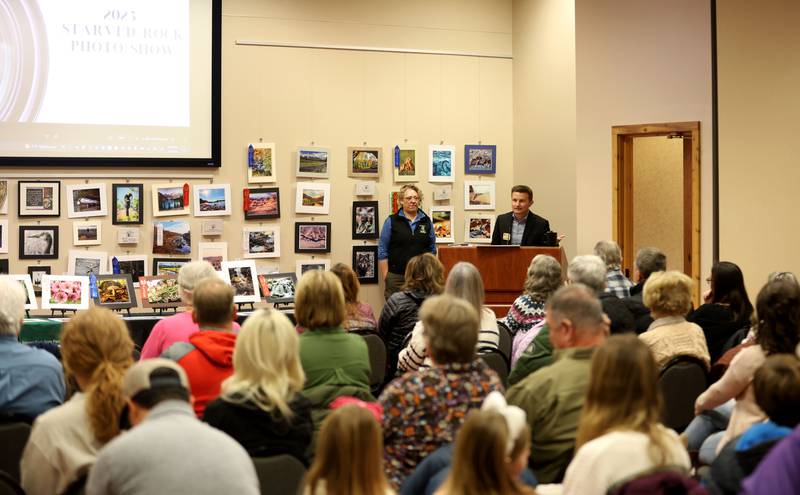 Matthew Klein vice president of the Starved Rock Foundation and Lisa Sons Natural Resource Coordinator at Starved Rock and Matthiessen State Parks welcome partipants during the Starved Rock Photography Show awards on Saturday, Jan. 3, 2026 at the Starved Rock Visitors Center. The show brought in 86 entries were submitted for this years show.