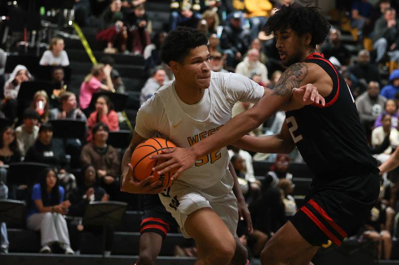 Joliet West’s Ethan Hillsman battles under the basket against Bolingbrook on Friday, Jan 24, 2025 in Joliet.