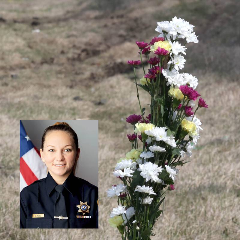 A memorial stands near visible ruts in the grass and skid marks Friday, March 29, 2024, at the site on Route 23 three-quarters of a mile south Perry Road, near DeKalb where DeKalb County Sheriff’s Deputy Christina Musil, 35, died in a crash while working a shift Thursday night.