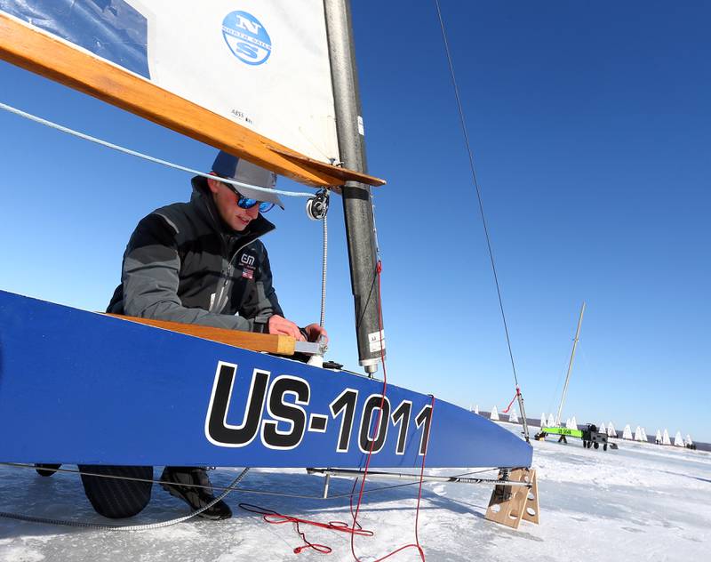 Samuel Barte, a student at the University of Wisconsin, works on his racing boat at the 2022 DN US National ice boat races on Senachwine Lake on Wednesday Jan. 26, 2022 near Putnam. Barte, has been racing for about two years and likes to participate as a hobby.