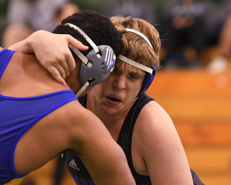 Mateusz Nycz of Marmion Academy wins the regional title match over Lyons Township wrestler Sam Costello in the 285 weight class on Saturday Feb. 3, 2024, held at Glenbard West High School.