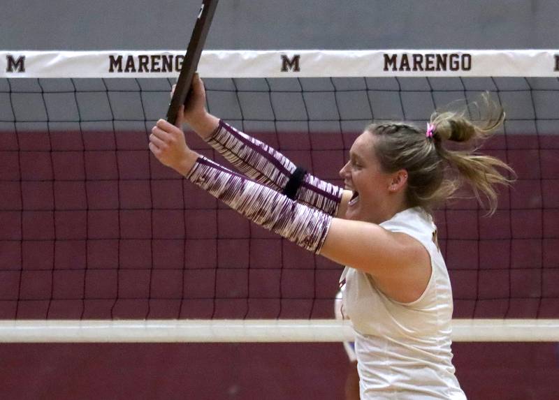 Richmond-Burton’s Elissa Furlan races back to her teammates with their trophy after a win over Genoa-Kingston in IHSA Class 2A Regional Title Game volleyball action on Thursday, Oct. 31, 2024, at  Marengo High School  in Marengo.