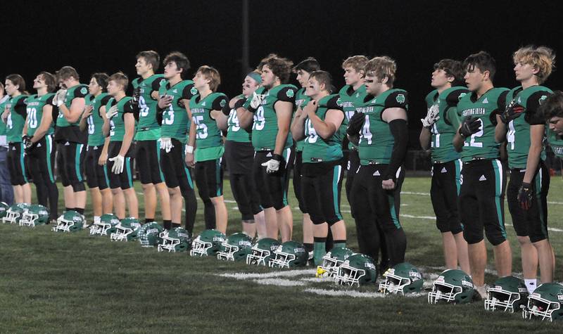 Members of the Seneca football team line up for the National Anthem before playing Byron in the second round of the IHSA Class 3A football playoffs on Friday, Nov. 4, 2022 in Seneca.