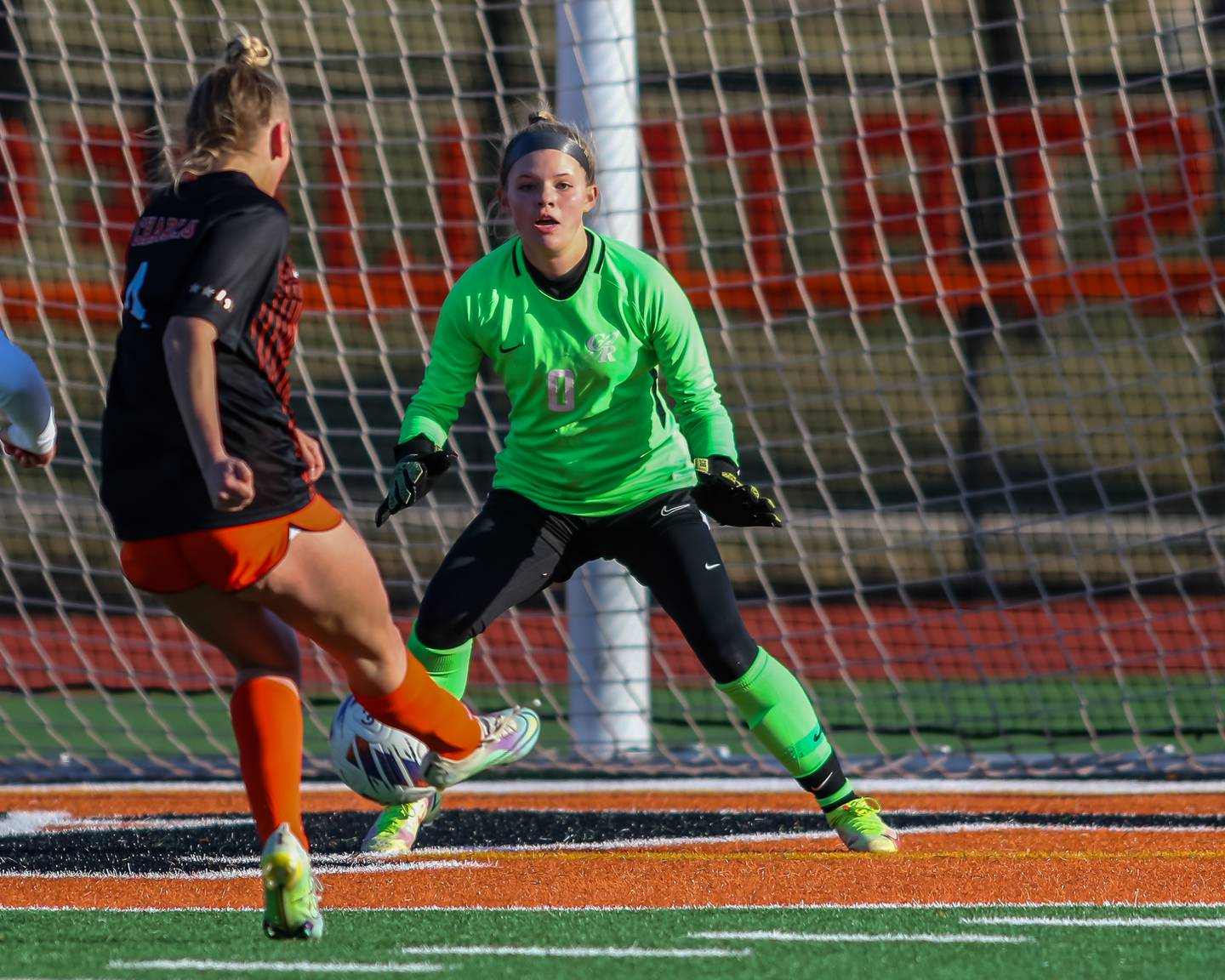 St Charles East's Grace Williams (4) kicks on goal during soccer match between Burlington Central at St. Charles East.  March 28, 2023.