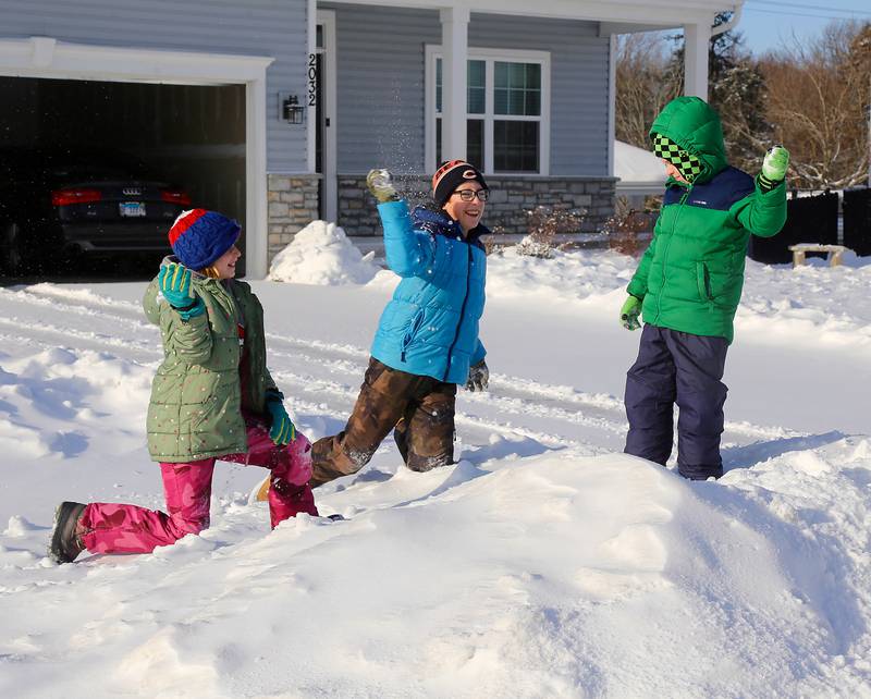 (Left to right) Kendall Meyer, Luke Meyer and Connor McDillion have a snowball fight on Saturday, Jan. 13, 2024 in Montgomery.