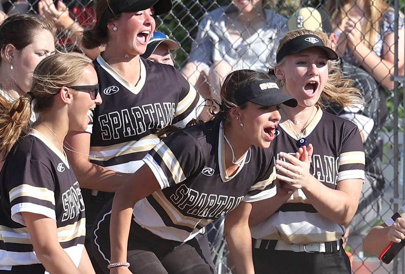 Sycamore players celebrate a home run by Kairi Lantz during their Class 3A regional championship game against Freeport Friday, May 26, 2023, at Sycamore High School.