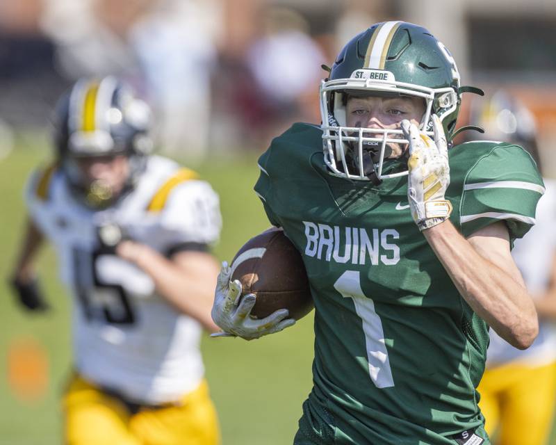 Alex Ankiewicz of St. Bede Academy runs the football down field for a large gain of yards against the Elmwood Park Tigers on September 30, 2023.