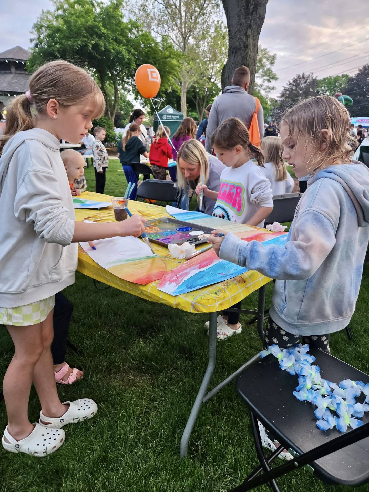 Kids paint and decorate their custom-made surfboard artworks at Yorkville's "School's Out Beach Party."