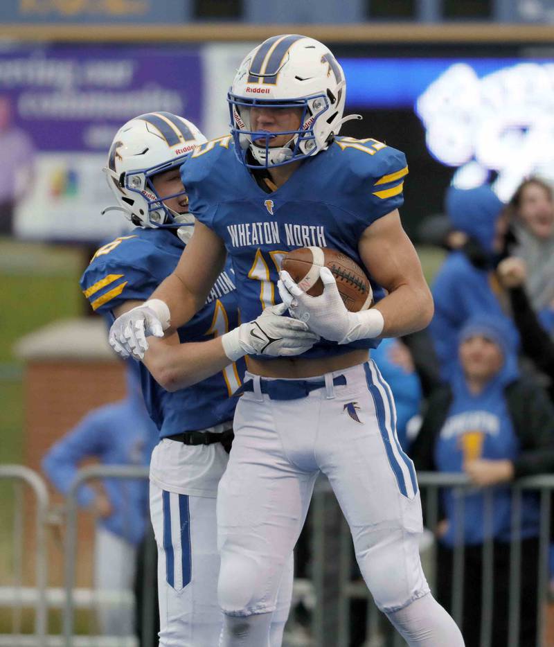Brian Hill/bhill@dailyherald.com
Wheaton North's Karsten Libby (15) celebrates with Wheaton North's Matt Kuczaj (16) after a touchdown during the second round of the IHSA playoffs Saturday November 5, 2022 in Wheaton.