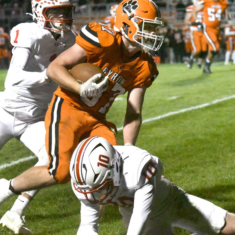 Byron's Caden Considine (37) eyes the end zone as Oregon's Katon Salsbury (10) tries to knock him out of bounds on Friday, Oct. 31, 2025 in the first round of the 3A state playoffs held at the Everett Stine Stadium in Byron.