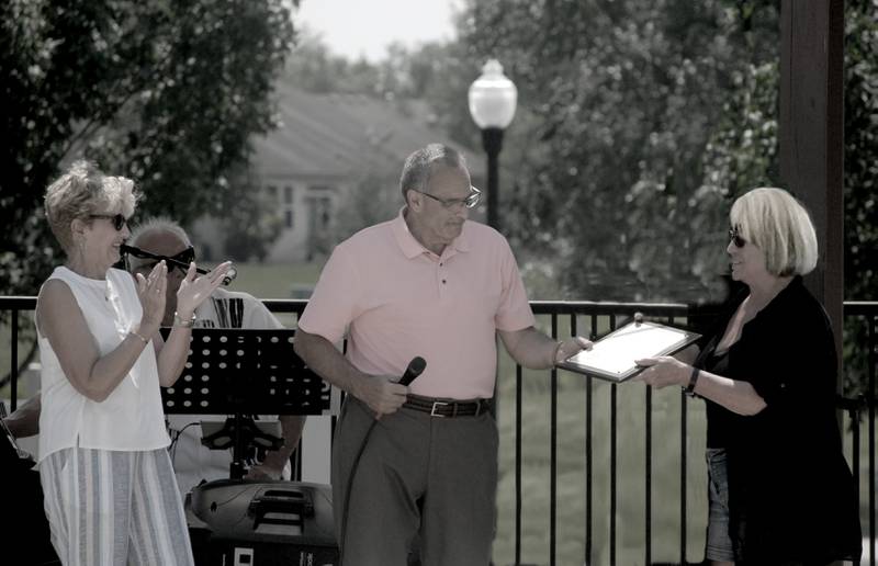 Ray Soliman, the mayor of Crest Hill, presented a city resolution proclaiming July 24, 2021, as  Carillon Lakes Day.  Pat Adams (left) and Karen Brown (right) from Carillon Lakes received the plaques.